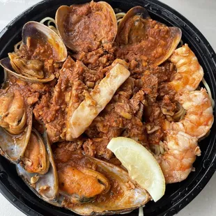 Seafood combination with tomato sauce