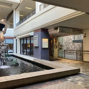 Storefront is next to the fountain