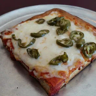 Slice of Sicilian with jalapeños