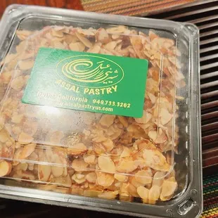 a container of nuts on a table