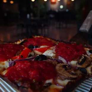 a pizza on a metal tray