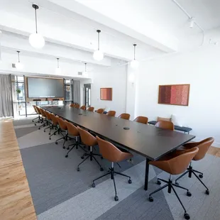 Our boardroom adapts an old &quot;fur vault&quot; from the building&apos;s historic department store roots, complete with the original vault frame door.