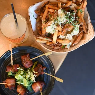 a plate of french fries and a bowl of salad