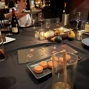 a man sitting at a table with food and drinks