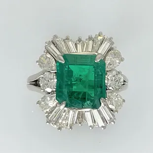Emerald and diamond platinum ring