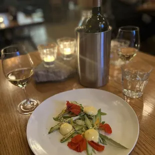 a plate of food and wine on a table