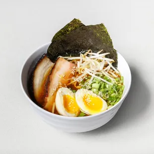 a bowl of ramen with a boiled egg