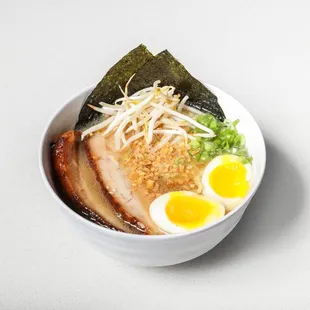 a bowl of ramen with a boiled egg