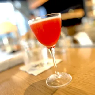 Paper Plane. pistachio infused bourbon, fresh lemon, select aperitivo, peach amaro