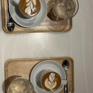 Espresso macchiato with homemade almond milk and bubbly water