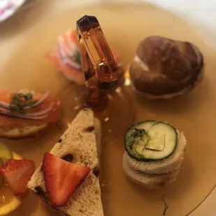 Tea sandwiches: salmon, strawberry, cucumber, and pimento cheese