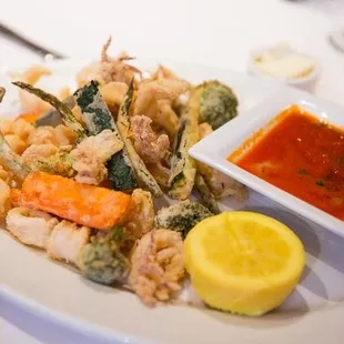 -Fritto Misto Con Calamari- Fried crispy calamari and vegetables, served with a spicy red sauce.