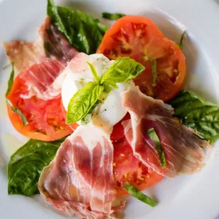 -Mozzarella di Burrata con Prosciutto- Heirloom tomatoes, Italian basil, Fresh Burrata mozzarella cheese, Parma Prosciutto &amp; EVOO