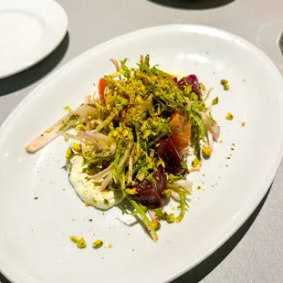Salad Special - whipped ricotta, beets, seasonal greens tossed in a lemon vinaigrette, and crushed pistachio ($18)