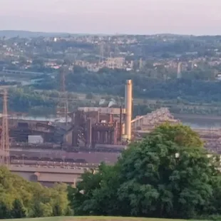 Kennywood park in the background.(Steel Curtain coaster) Steel mill in the foreground.