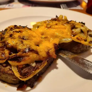 Texas Meatloaf Special - two pieces of good meatloaf topped with grilled onions, cheddar cheese, bacon and BBQ sauce