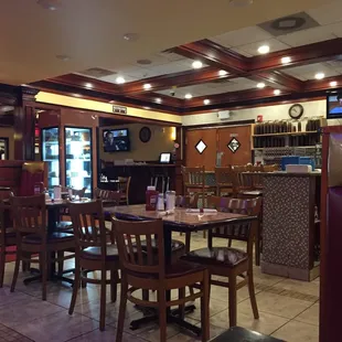 View of pastry case, bar, and TVs