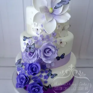Purple ombre hues with edible sugar flowers and butterflies