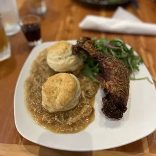 Fries chicken and biscuits / gravy.,.