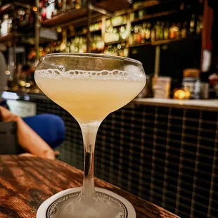 a margarita sitting on a bar counter