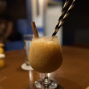 a drink in a glass on a table