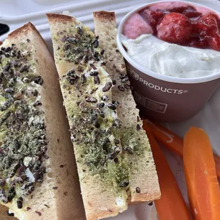 Egg salad sandwich, pickled carrots, and strawberry pudding