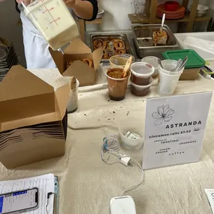 Lots of cinnamon rolls ready to be frosted!