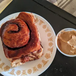 Cinnamon roll with coffee frosting, reheated