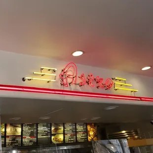 the neon sign above the counter