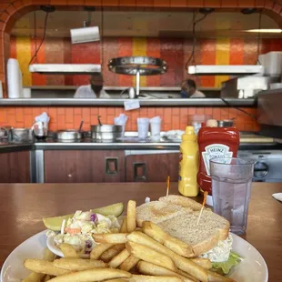 Tuna sandwich served with coleslaw and fries