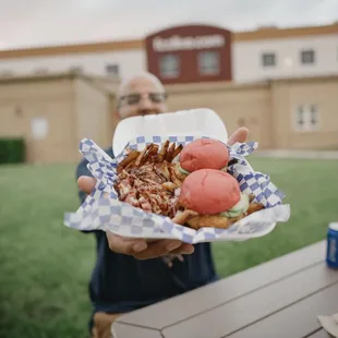 a man holding a plate of food
