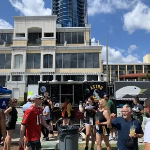 a large group of people standing in the grass