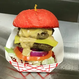 Double Astro slider.  Two angus beef patties, American cheese, lettuce, tomato, red onion, and our famous Astro sauce.