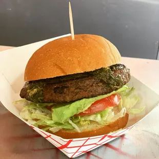 Black Hole slider 100% vegan slider Homemade black bean patty, lettuce, tomato, avocado, house made chimmichurri sauce.