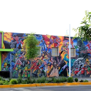 The outside of our shop. This mural, done by local artist Dave Briggs, has won 2 world wide awards in the comic industry.