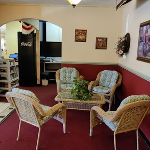 a living room with wicker furniture