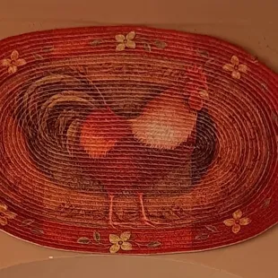 a rooster in a basket