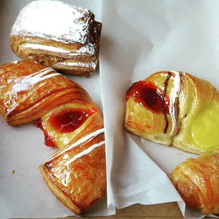 a variety of pastries in a box