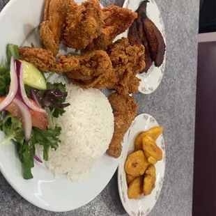 Fried Chicken, sweet plantains, salty plantains, red White Rice and Beans, small salad