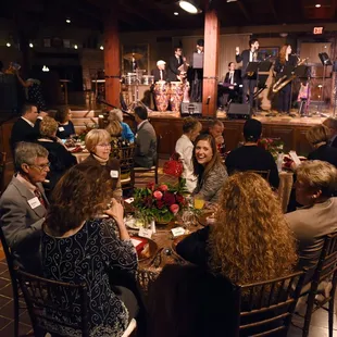 a group of people sitting around a table