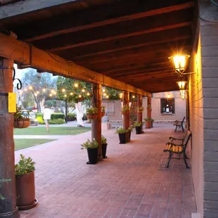 a brick walkway with lights on it