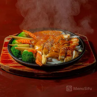 a steaming plate of food