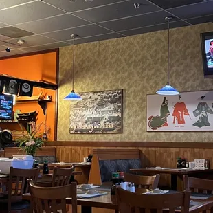 a dining area with tables and chairs