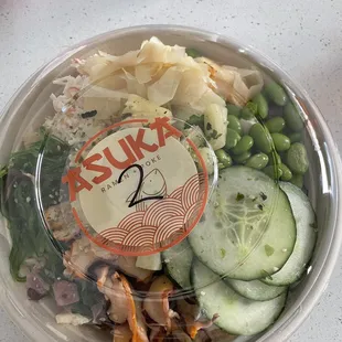 a salad in a plastic bowl