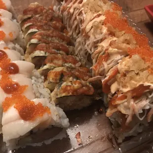 Sushi takeout!   Left to right: Romeo and Juliet roll, Dynamite roll, and Kaigan Special roll