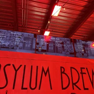 the sign for asylum brewing