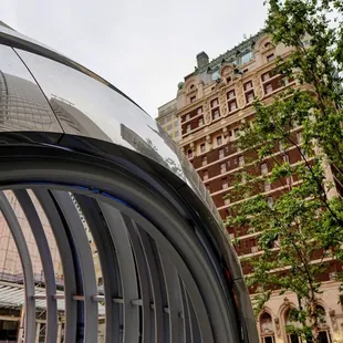 Spherical structure against the backdrop of The Adolphus Hotel