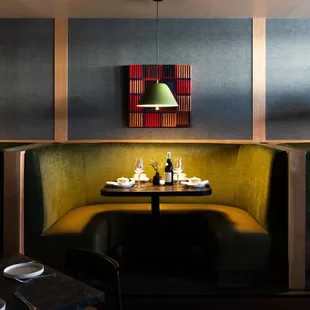 a booth with a table and chairs