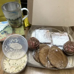 Clockwise Lemon bars, chocolate cupcakes with chocolate cream cheese frosting, snickerdoodle's, chicken salad, and loose leaf tea mug