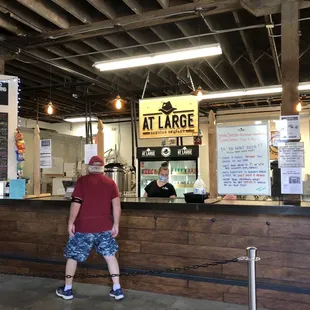 a man standing at the counter